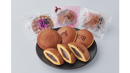 Kura Dora made with bean paste from Bitchu Dainagon red beans. Momotaro Dorayaki with Tsuyama wheat batter, filled with red bean paste and millet mochi. 178 Dora featuring the classic Kura Dora branding.